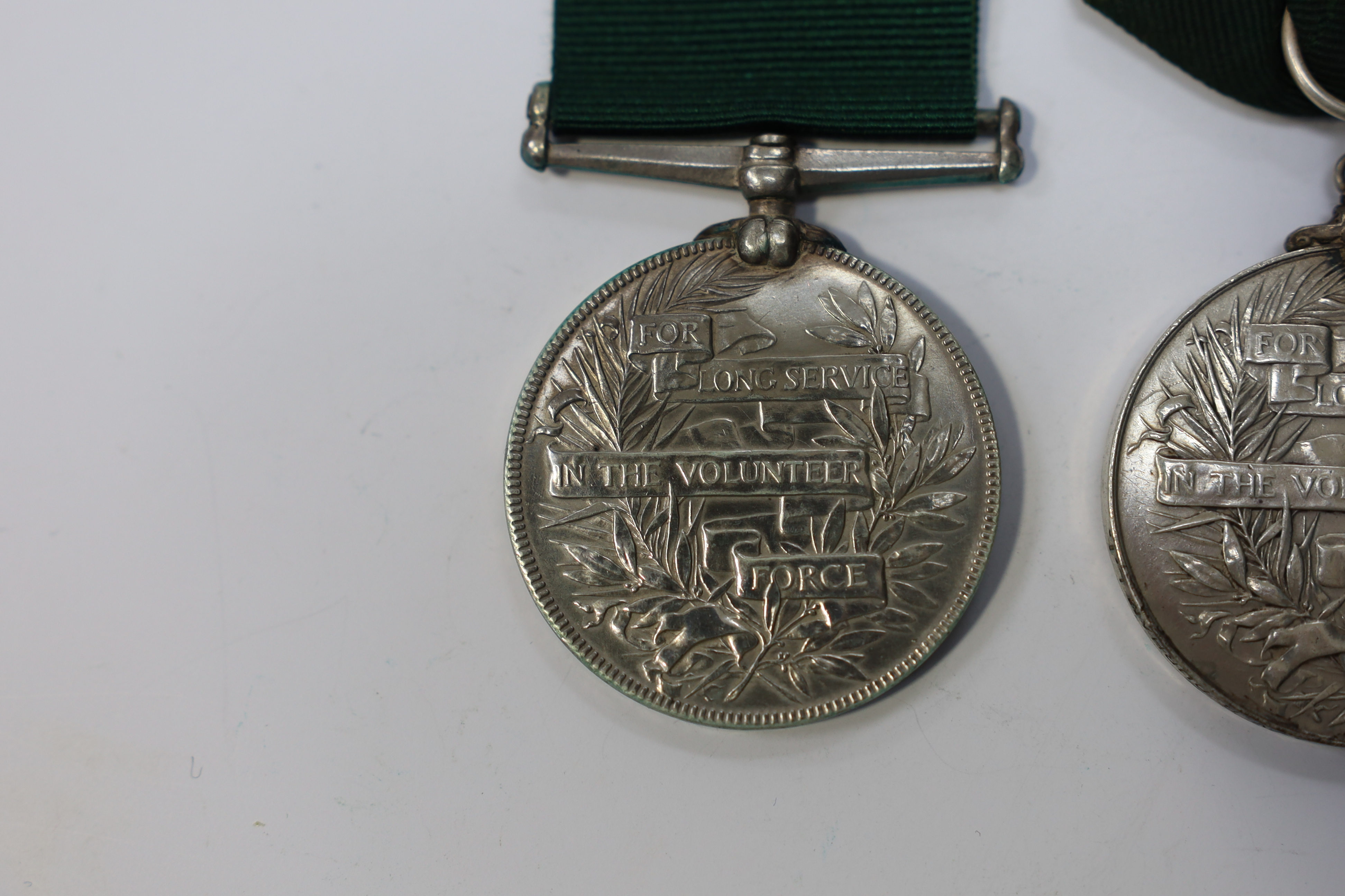 Three assorted service medals; Vict Volunteer Long Service to 186. Cpl. J.Camplin. 1st Dorset.Vol.Art: Ed VII Volunteer Long Service to 2731 Sjt:A.G.Wright. 4/V.B.Durham L.I.; ERII Territorial Efficiency Medal to 2228226